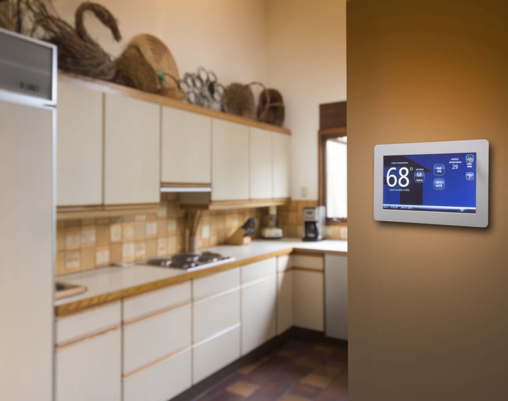 a smart thermostat in cherry hill sits on a wall